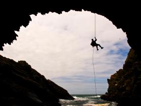 Abseil down Parliament House Cave in Anglesey