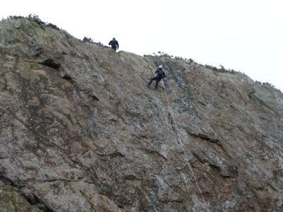 Abseiling sea cliff
